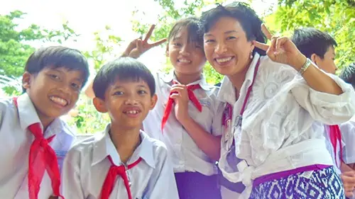 Dr. Pien providing medical care to disadvantaged children on a medical mission to Vietnam.