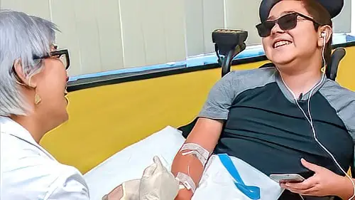 Dr. Pien providing life saving treatment to one of our many young patients diagnosed with a terminal disease.