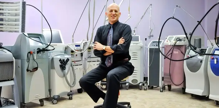 dr asher milgrom header with laser