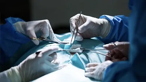 surgeons performing surgery