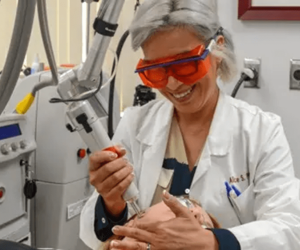Dr. Pien performs a non-invasive laser treatment, often used in conjunction with stem cell therapies at AMA RegenMed to enhance skin rejuvenation and healing