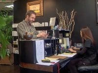 Patient checks out at the AMA Regen Med reception desk after completing their ozone therapy for sinus issues.