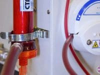 Detailed view of the blood passing through the rotary pump and tubing, approaching the filter mechanism for cleansing and treatment.