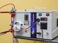 Extracorporeal Blood Oxygenation and Ozonation (EBOO) machine sitting on a cart with all tubing and components ready for use.