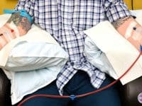 A patient comfortably undergoing an EBOO apheresis and ozone therapy session at the AMA Regenerative Medicine clinic in LA.