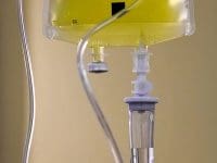 Intravenous drip bag with nutrients or vitamins, often used as supportive IV therapy for patients with Long COVID.