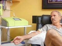 Patient Randy sitting comfortably while undergoing ozone therapy for his chronic Lyme disease treatment.