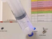 Syringe being filled from an ozone generator machine, ready for a regenerative joint injection.