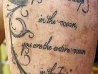 Close-up of a patient's tattoo featuring an inspiring quote: "You are the entire ocean in the drop."